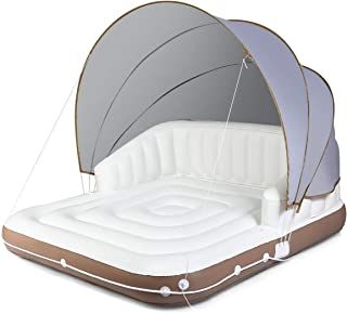 an inflatable bed is shown with the canopy opened to reveal it's inner structure