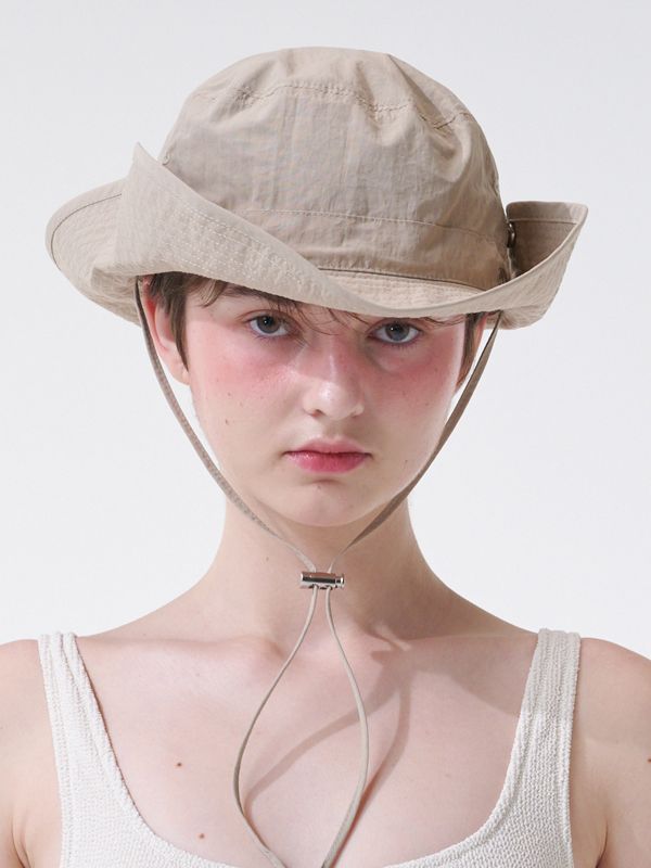 SIEOR is a global brand loved by many artists for its comfortable and simple details that harmonize with daily life.- Great fitting bucket hat with string and stopper- Engraved brand's logo metal decoration detail- You can create a variety of looks with snap button- Comfortable to wear Classic Beige Adjustable Bucket Hat, Beige Adjustable Bucket Hat, Adjustable Eco-friendly Bucket Hat With Curved Brim, Eco-friendly Adjustable Bucket Hat With Short Brim, Bucket Hat With String, Adjustable Bucket Hat With Upf 50+ For Fishing, Global Brands, Light Beige, Metal Decor