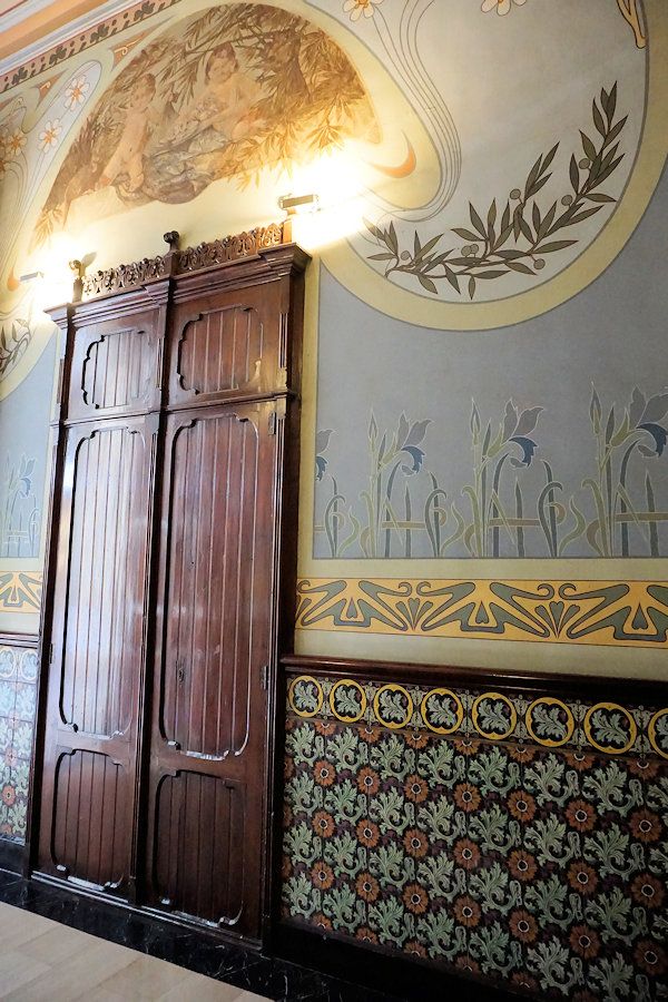 an ornately decorated room with wooden doors