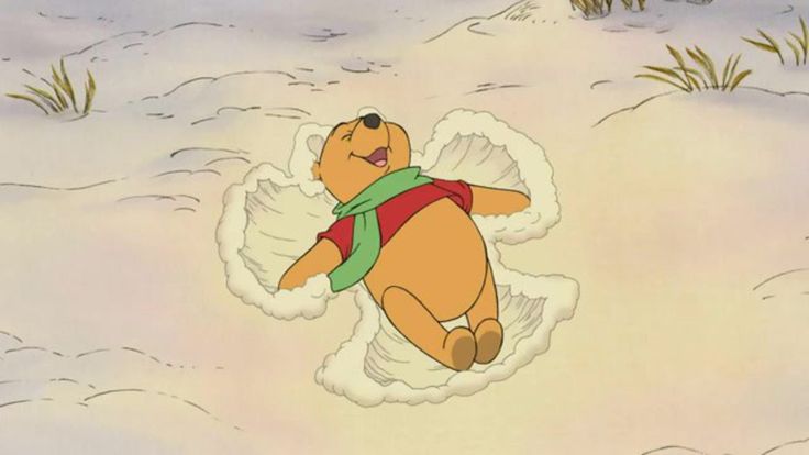 winnie the pooh flying through the air with an angel halo around his neck and wings