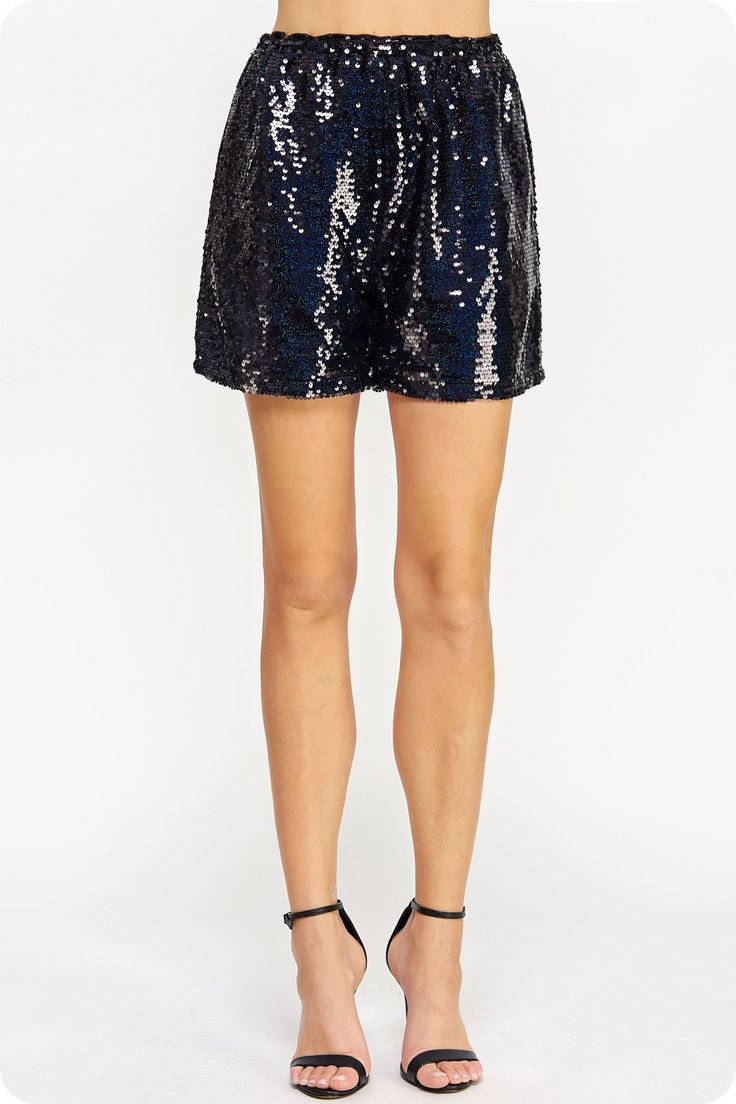 Dressy shorts in sequin fabric. This style features elasticated waist, full lining for comfort, and side pockets. The perfect shorts for the holiday season or a night out Sequin Party Shorts, Contrast Sequin Bottoms For Summer Party, Summer Party Bottoms With Contrast Sequin, Sequin Shorts For Night Out And Party Season, Party Sequined Shorts, Party Shorts With Sequins, Sequined Short Length Bottoms For Party Season, Sequined Party Shorts For Summer, Short Sequined Bottoms For Party Season