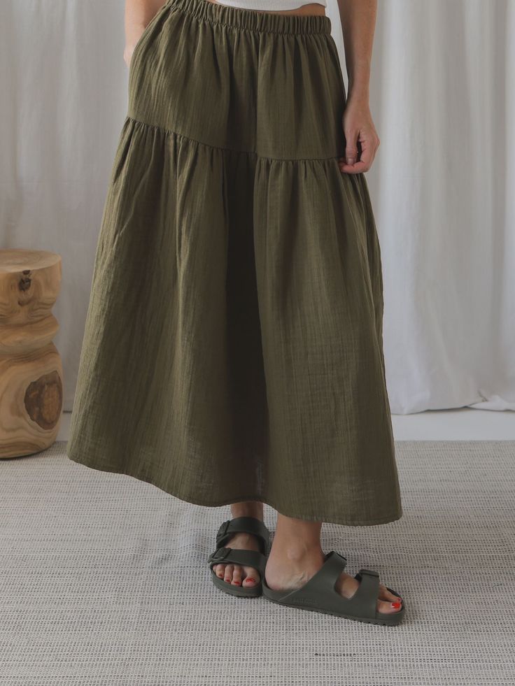 You asked, and we listened. The women's skirts are here! Now, you can finally create twinning outfits for you and your little one! 100% organic cotton, 130g. We are introducing a NEW women's version of our bestselling Tutti skirt. Lightweight and breathable with an elegant shape that falls to a mid-calf length is ideal for summer escapades, beach-days or evening alfresco. It's simple, versatile and easy to style plus it has two handy pockets. We love wearing it with our women's boxy t-shirts. Mo Relaxed Cotton Midi Skirt, Cotton Gathered Skirt Bottoms, Green Flowy Cotton Skirt, Green Cotton Casual Maxi Skirt, Casual Cotton Flared Skirt Bottoms, Casual Cotton Flared Skirt, Summer Cotton Lined Skirt, Cotton Tiered Maxi Skirt With Pockets, Cotton Tiered Skirt With Solid Color