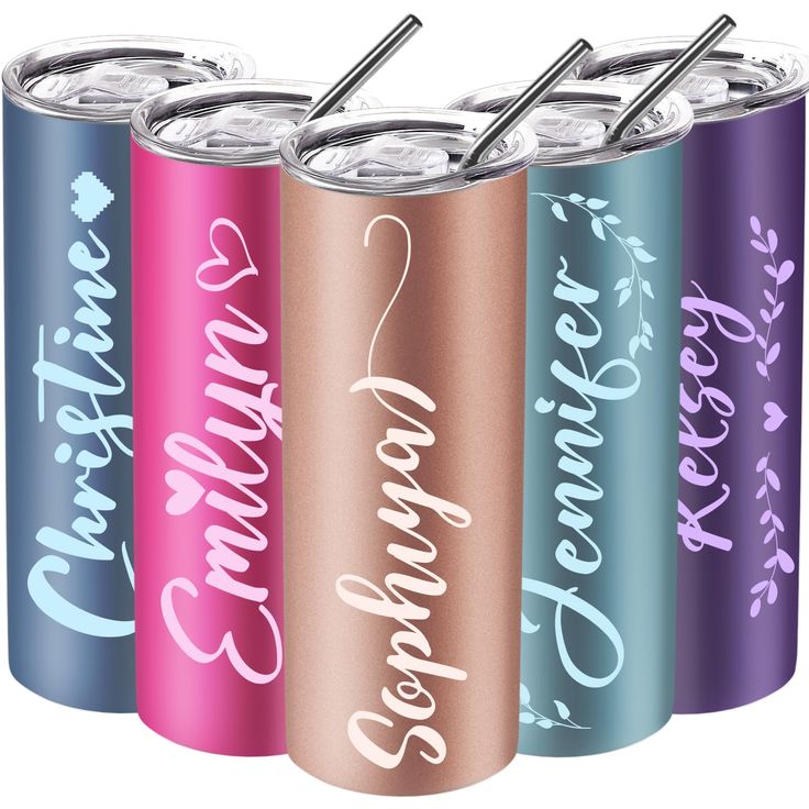 four different colored cans with straws in them