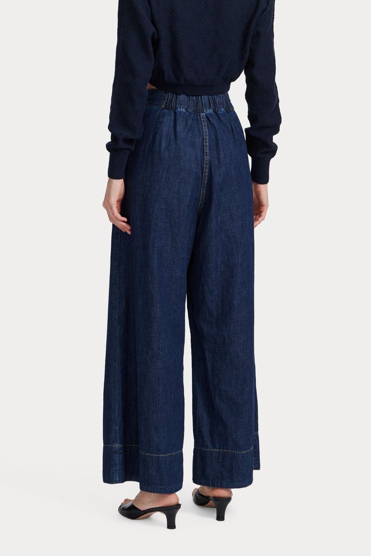 An RC go-to pant, the Coxsone is an easy, pleated, high-waisted trouser with a wide leg, cut this season in Vista Denim. 100% Cotton Faux button fly Invisible side zipper Elastic waistband at back Side slip pockets Made in USA Dark Wash Wide Leg Pants For Work, Dark Wash Wide-leg Workwear Pants, Dark Wash Wide-leg Pants For Workwear, Wide-leg Dark Wash Pants For Work, Denim Wide Leg Pants For Work, Workwear Wide-leg Jeans With Elastic Waistband, Dark Wash Wide-leg Workwear Bottoms, Dark Wash Wide Leg Pants For Work In Spring, Dark Wash Wide Leg Work Pants With Five Pockets