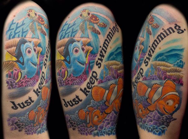 some tattoos that are on the legs of someone's leg and one has an image of finding nemo