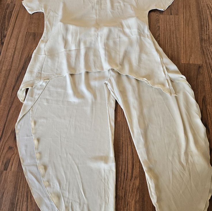 Light Cream Rayon Pants And Shirt.. Flows Very Well.. Size 2x. Pants Look Like 2x But Shirt Is Smaller Than A 2x.. Beautiful Beach Wear..Never Worn Waist Is 18in Across With Elastic Waist Band So Could Expand...Shirt Is 23in Across Right Under The Arms Is Where I Measured.. Stretch Short Sleeve Pant Set For Spring, Spring Stretch Short Sleeve Pant Set, Spring Stretch Pant Set With Short Sleeves, Spring Short Sleeve Stretch Pant Set, Summer Short Sleeve Stretch Pant Set, Pants And Shirt, Cheetah Print Leggings, Free People Jumpsuit, Dark Grey Leggings