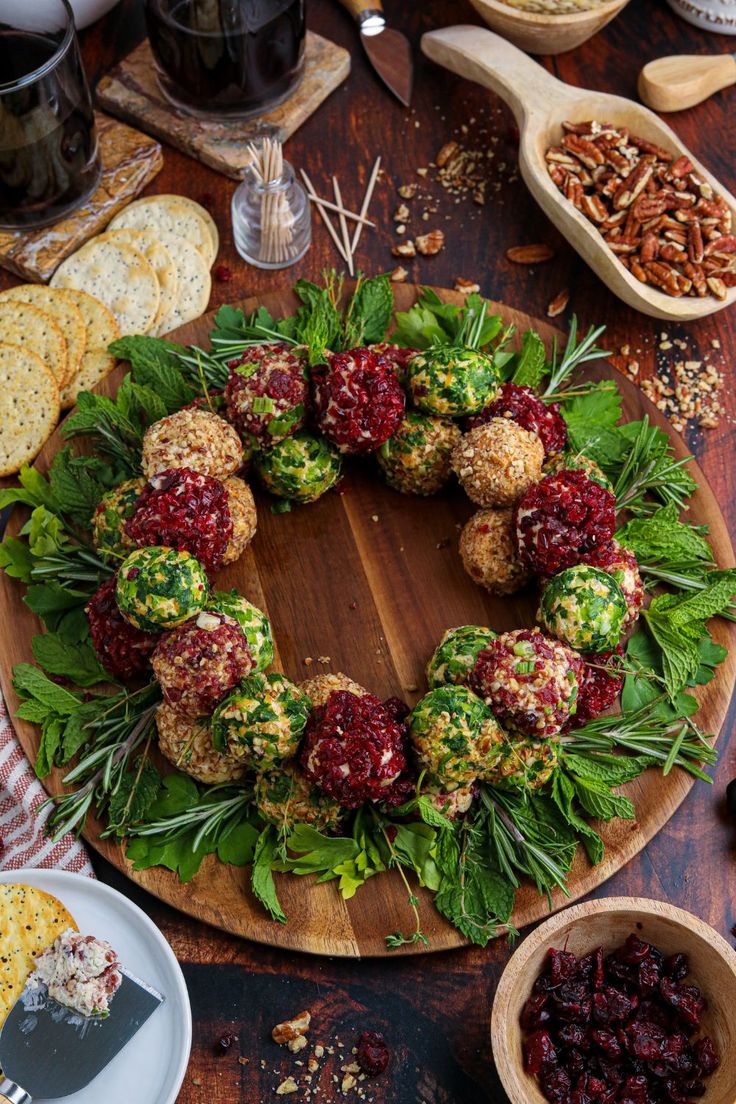 a wooden platter filled with food on top of a table next to other foods