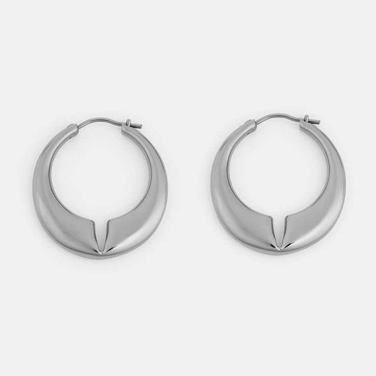 The Lune is a contemporary hoop earring with rounded edges and a deep notch at the center of the design. The domed effect tapers towards the ends, finishing with a minimal pin closure. Materials: Stainless Steel Modern Metal Hoop Huggie Earrings, Modern Nickel-free Hoop Earrings For Formal Events, Modern Nickel-free Hoop Earrings For Formal Occasions, Modern Metal Huggie Earrings For Everyday, Minimalist Metal Hoop Earrings With Polished Finish, Modern Metal Small Hoop Huggie Earrings, Modern Small Hoop Metal Huggie Earrings, Modern Metal Huggie Earrings, Minimalist Teardrop Hoop Earrings With Polished Finish