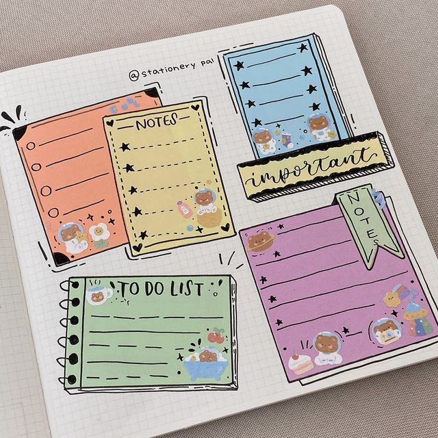 an open notebook with stickers on it