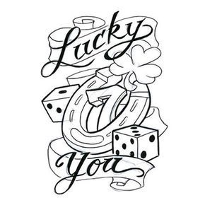 the word lucky you with dices and hearts in black ink on a white background