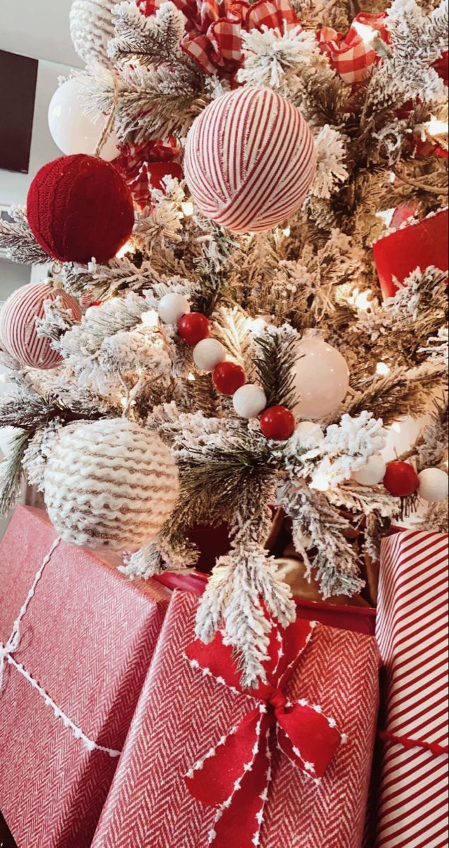 a christmas tree decorated with red and white ornaments