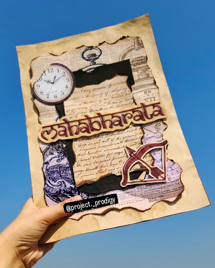 a hand holding up a piece of paper with an image of a clock and letters on it