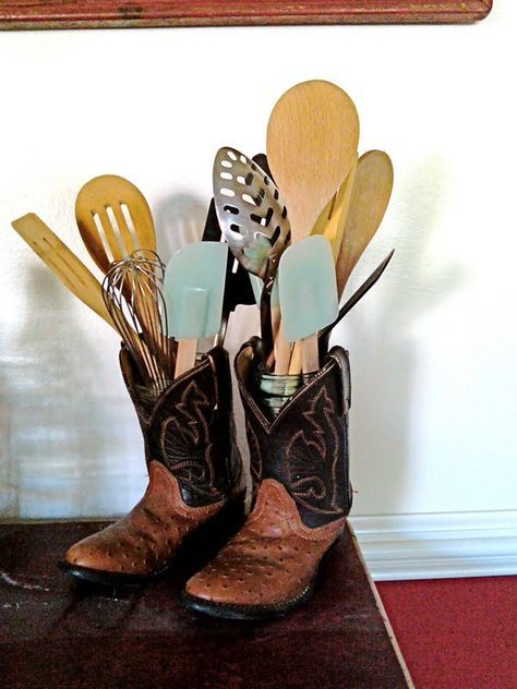 a pair of cowboy boots with utensils in them