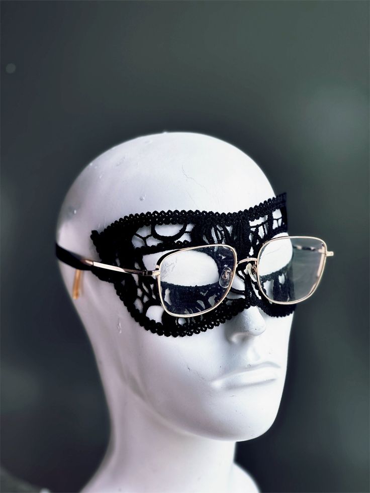 Crafted with meticulous precision and designed for ultimate comfort, this black lace mask allows you to keep your glasses on while indulging in the thrill of the masquerade. Perfect for formal events, costume parties, or any occasion where you want to make a dramatic entrance.

Age Group/Gender - Adult/Men

Size/Type - One size fits all adults

Mask Color - Black

Mask Material - Lace Adjustable Eye Masquerade Mask, Adjustable Eye Mask For Masquerade, Elegant Black Mask For Costume Party, Elegant Black Eye Mask, Adjustable Eye Mask For Halloween Masquerade, Adjustable Black Masquerade Mask For Carnival, Black Adjustable Masquerade Mask, Black Adjustable Masquerade Mask For Carnival, Gothic Eye Mask For Evening Masquerade