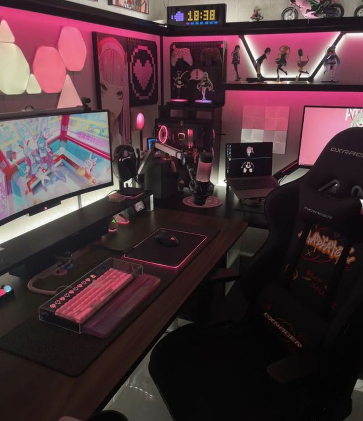 a computer desk with two monitors, keyboard and mouse on it in front of pink lighting