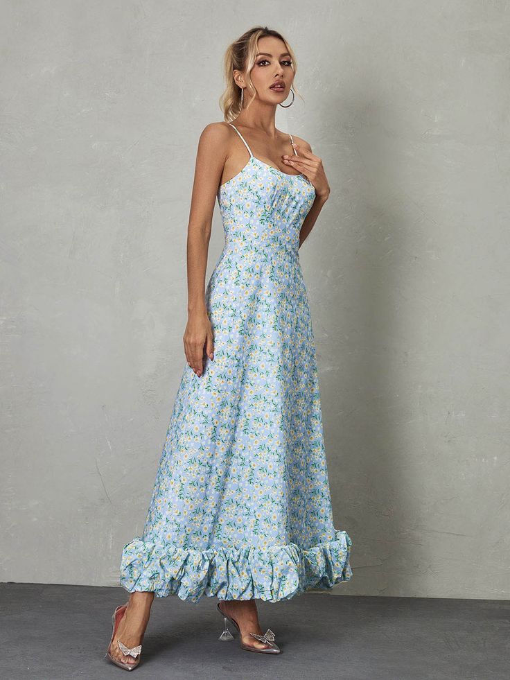 The Ilsa Spaghetti Floral Maxi Dress in Blue is a breathtaking display of beauty and charm. With its delicate spaghetti straps and vibrant floral pattern, it exudes a sense of feminine grace and elegance. The flowing maxi length adds an ethereal touch, making it an ideal choice for special occasions or summer soirées where effortless glamour is desired. Material: 100% Polyester Invisible zipper opening at the back Stretch Factor: Non Stretch Clean: Gentle machine wash Color may vary due to the l Blue Sundress With Adjustable Straps For Garden Party, Blue Fitted Maxi Dress With Ruffled Straps, Spring Maxi Dress With Ruffles And Spaghetti Straps, Sundress Maxi Dress With Sweetheart Neckline And Adjustable Straps, Blue Maxi Dress With Sweetheart Neckline For Garden Party, Blue Maxi Dress With Sweetheart Neckline For Summer, Blue Maxi Dress With Sweetheart Neckline For Spring, Light Blue Spring Dress With Adjustable Straps, Light Blue Fitted Maxi Dress With Spaghetti Straps