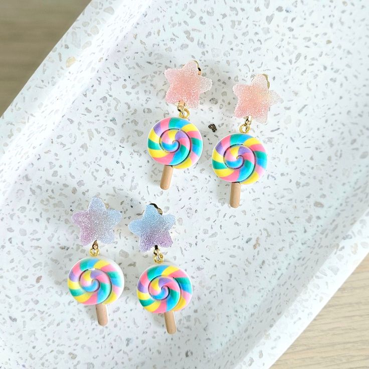 Clip-On Earrings with a Smile! These adorable pastel earrings are made from polymer clay and resin with gold plated iron clip-on backing. Each clip will have a white rubber attached for comfort and support on those little ears.  Approximate size: 50mm x 20mm **Shop with confidence- All orders will have tracking numbers** Dangly Clip On Earrings, Whimsical Pink Earrings For Gift, Colorful Whimsical Earrings For Gifts, Whimsical Earrings As A Gift, Handmade Sweet Earrings For Party, Sweet Drop Earrings As A Gift, Whimsical Colorful Earrings For Gifts, Sweet Drop Earrings For Gift, Sweet Handmade Earrings For Gift