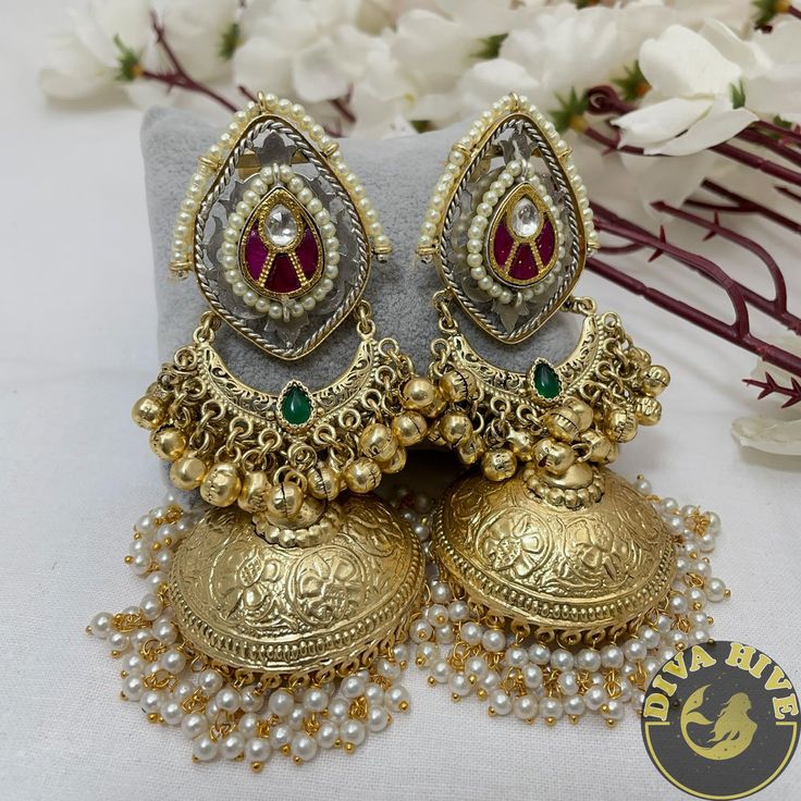 Diva Exclusive Statement Earring in Brass plating with silver coated Metal : Brass with 92.5 Silver Polished Nickel Free Handcrafted Perfect for all occasion(Party, Wedding ,Engagement) Free US standard shipping Ready to ship from New Jersey , United States Highest quality and craftsmanship CARE Store them in moisture free areas and keep them away from water and liquid fragrances Luxury Chandbali Temple Jewelry Jhumkas, Luxury Temple Jewelry Jhumkas For Rituals, Luxury Festive Hallmarked Jhumkas, Luxury Traditional Jhumkas With Elegant Design, Luxury Heavy Chandbalis For Party, Luxury Stone Work Jhumkas For Wedding, Luxury Party Jhumkas With Stone Work, Luxury Drop Chandbalis For Celebration, Luxury Heavy Jhumkas For Ceremonial Occasion