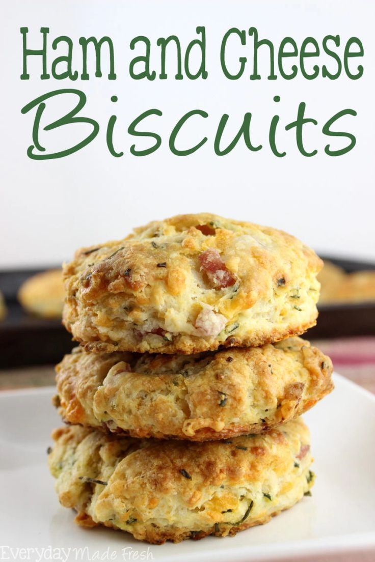 three biscuits stacked on top of each other with the words ham and cheese biscuits in the background