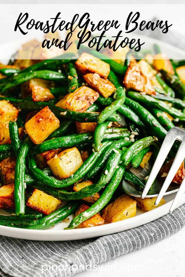 roasted green beans and potatoes on a white plate