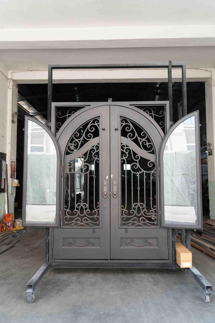 an iron gate is opened to reveal the inside