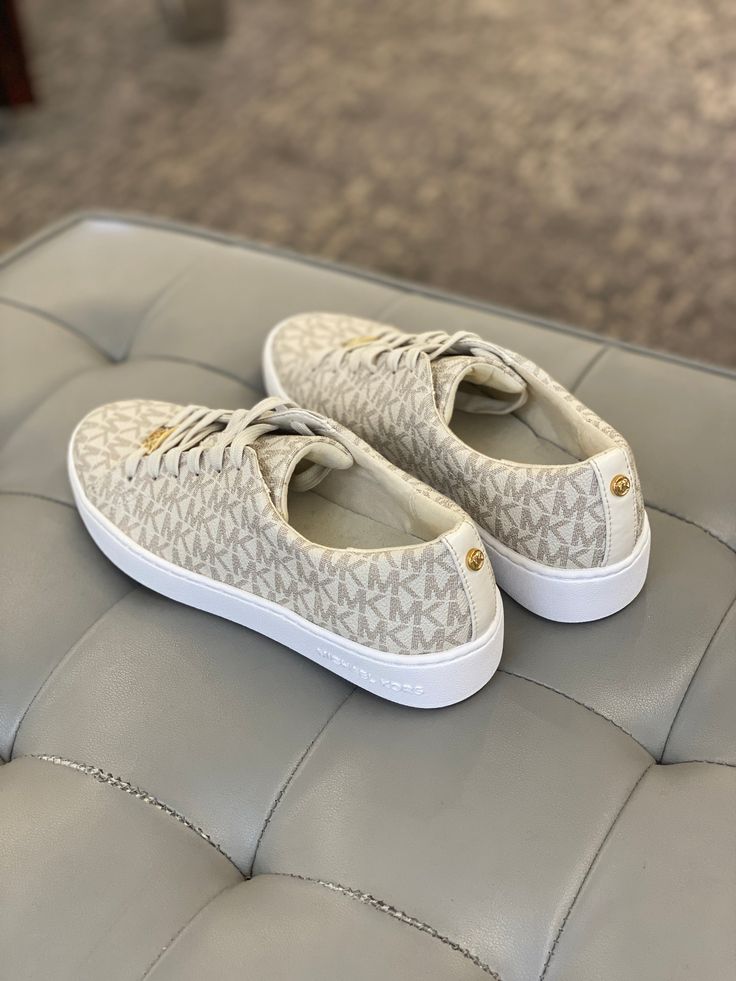 Give your casual style a luxe makeover. The Keaton sneakers by MICHAEL Michael Kors. Manmade faux leather upper Round closed-toe sneakers Rubber sole MK logo Imported