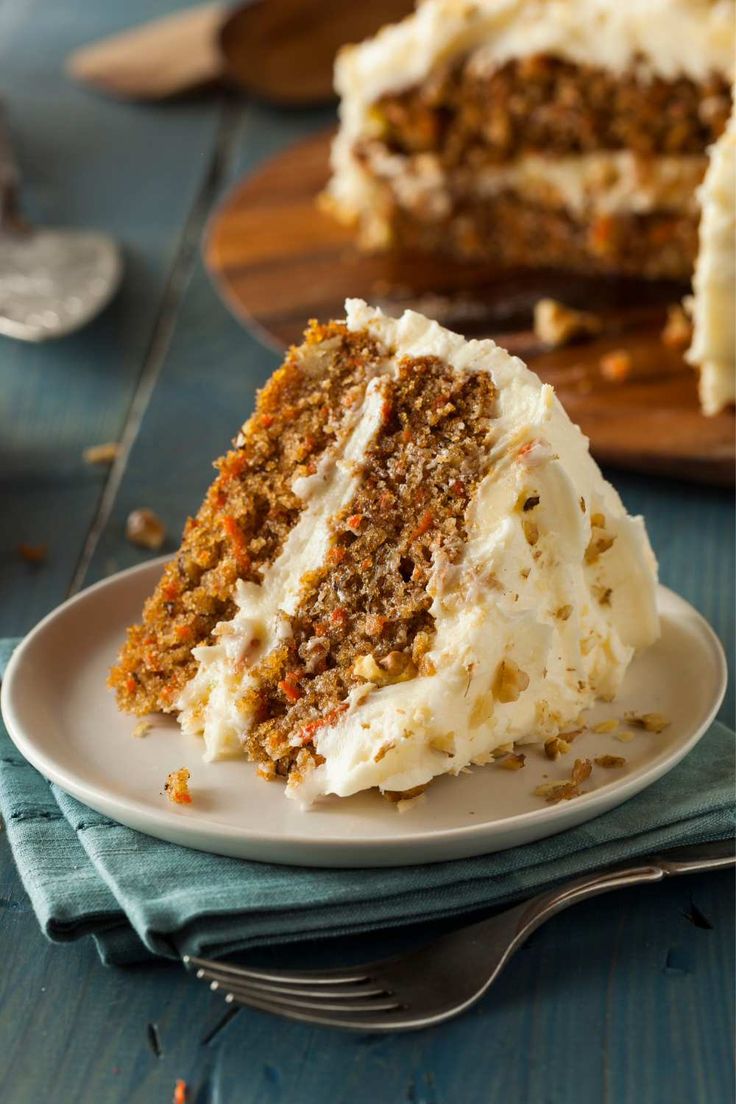 a slice of carrot cake on a white plate