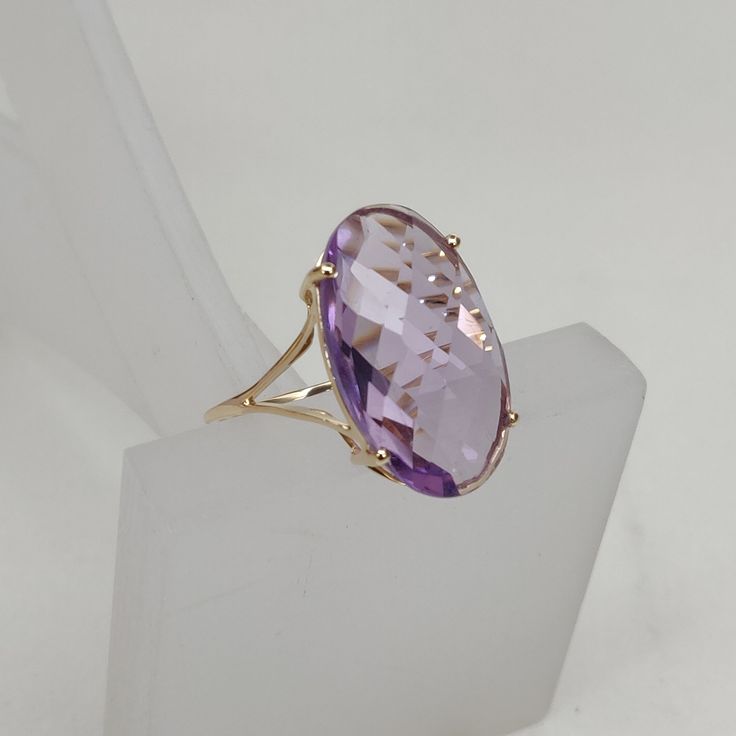 This stunning ring is set in 14k Solid Yellow Gold with Natural Purple Amethyst with utmost precision. It is a unique statement gemstone ring for nearly every occasion and is completely hassle-free jewelry. ITEM DETAILS: * GEM: Purple Amethyst * GEM SIZE: 20X12mm * GEM SHAPE: Oval * Total Gem weight: 11.75 carats * Gold Purity: 14KT  * Gold Weight: 1.59 gram * Total Weight of the Ring: 3.94 gram The Gold purity is guaranteed and it comes with an authentic 14KT gold hallmark. Since my items are h Elegant Faceted Amethyst Ring In Yellow Gold, Formal Purple Faceted Ring, Formal Faceted Purple Ring, Formal Faceted Amethyst Ring Fine Jewelry, Faceted Amethyst Ring In Yellow Gold Fine Jewelry, Purple Faceted Ring For Formal Occasions, Elegant Purple Faceted Rings, Oval Diamond Cut Amethyst Ring, Elegant Faceted Amethyst Wedding Ring