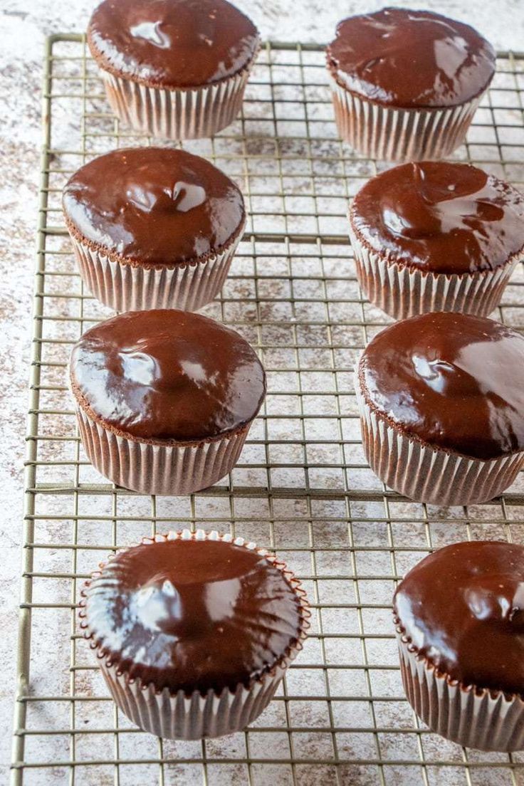 chocolate cupcakes cooling on a wire rack