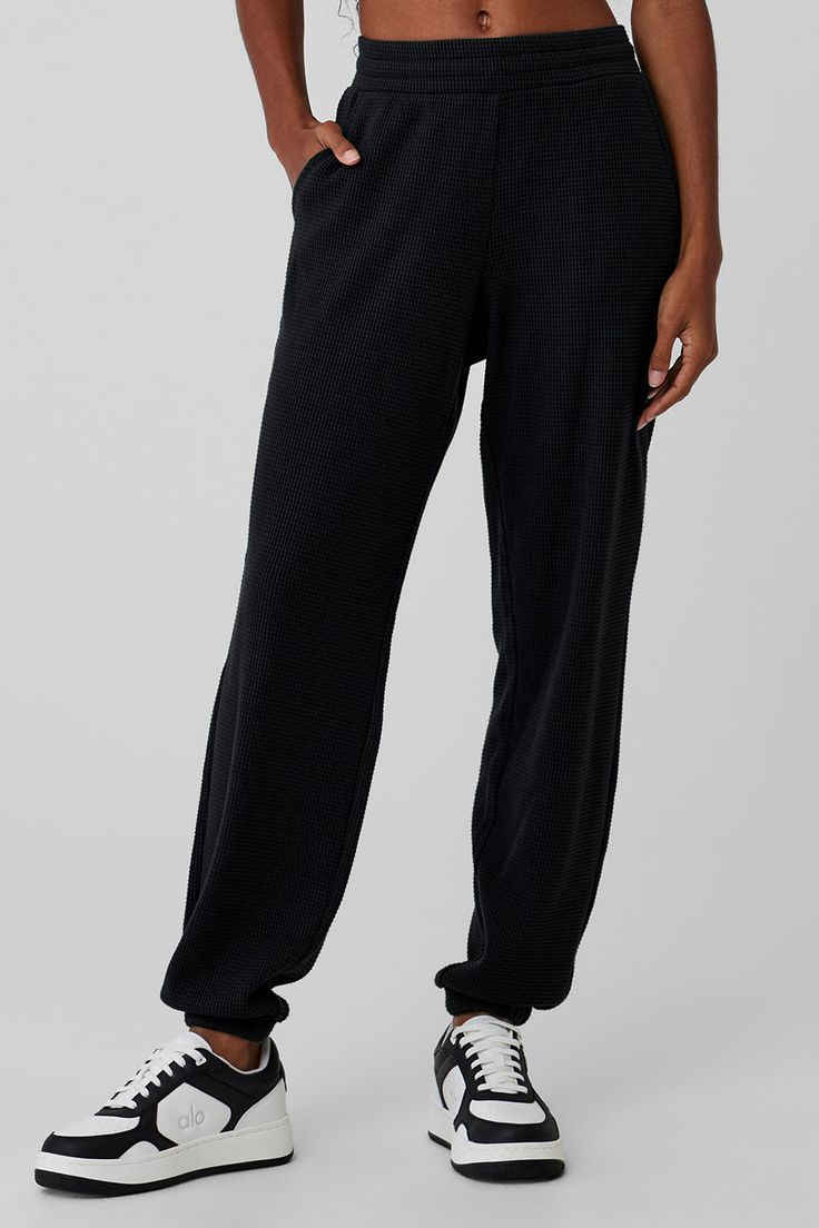 You'll chill in them, take walks around the block in them, tackle long-haul flights in them—these lounge pants are that good. They're made from a soft, warm waffle knit with a stretchy high-rise waistband, a laid-back (but not loose) fit and cozy ankle cuffs. Side pockets and a tonal Alo patch round it all out. And for cutest results, pair them with the matching bra and mock neck shirt. Christmas Wants, Mock Neck Shirt, Womens Black Pants, Long Haul Flight, Weekend Escape, Yoga Shop, Athleisure Outfits, Long Haul, Ankle Cuffs