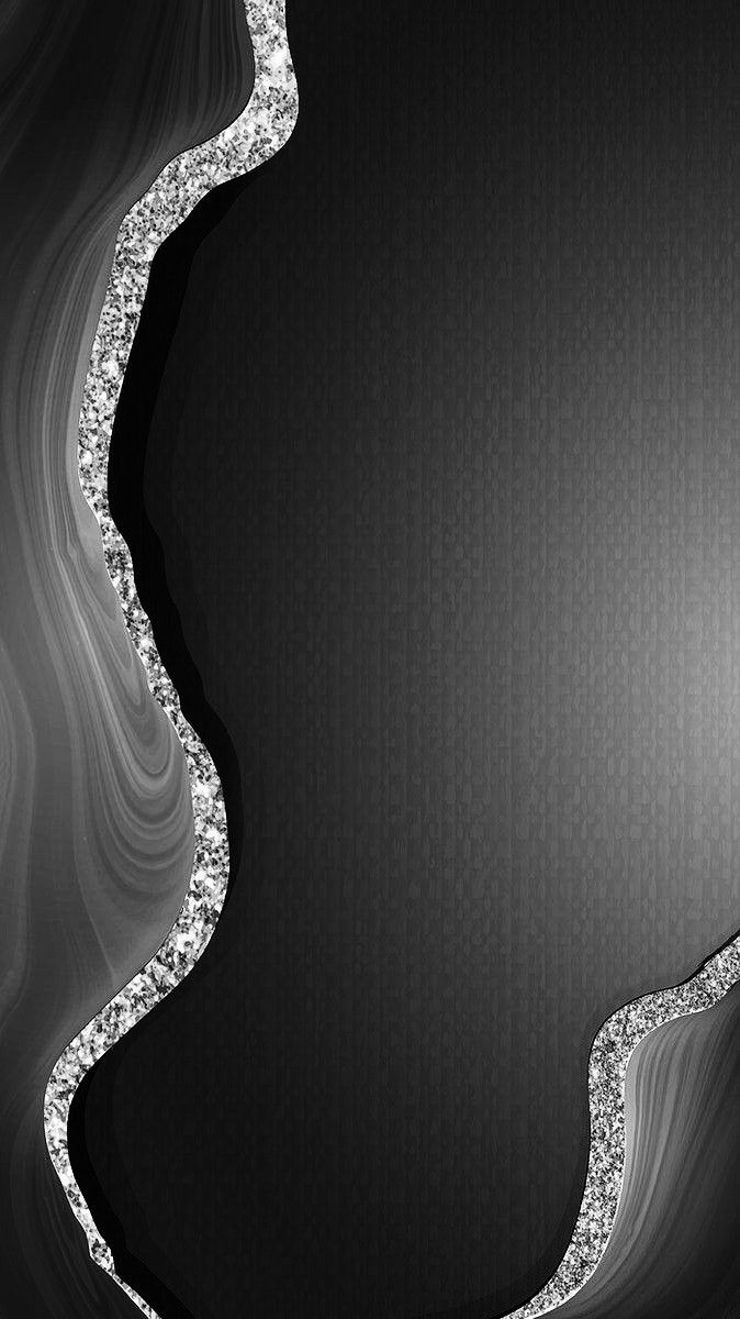 an abstract black and white background with some silver sparkles on the edges, like waves or curves