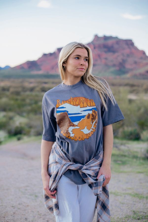 One of our most favorite designs is back and better. Meet the Rocky Mountain Tee-your new favorite graphic tee. Crafted in the USA, this tee is the perfect addition to your outdoorsy wardrobe. Whether you're summiting peaks or busting a move with the local wildlife, our tee ensures you're effortlessly rocking the Rockies in style! 🏞️🎉 Graphic Tee For Adventure, Relaxed Fit Graphic Print Top For Adventure, Casual T-shirt With Front Print For Outdoor, Relaxed Fit T-shirt For Fall Outdoor Activities, Casual Tops With Front Print For Outdoor Activities, Outdoor Relaxed Fit Top With Front Print, Casual Tri-blend T-shirt For Adventure, Fall Graphic Print T-shirt For Outdoor Activities, Graphic Tee With Relaxed Fit For Outdoor Activities