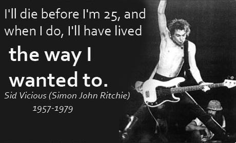 a black and white photo with an image of a man holding a guitar in the air