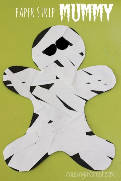 the paper strip mummy is cut out to look like it has been made into a ghost