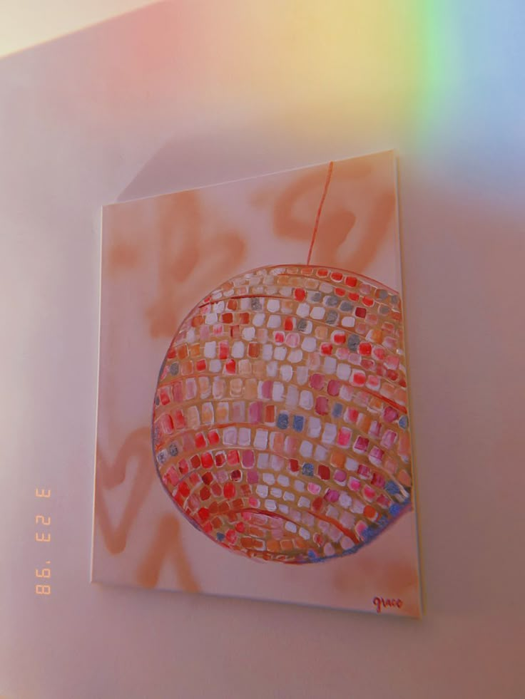 a painting on a white wall with a colorful light coming from the top and bottom