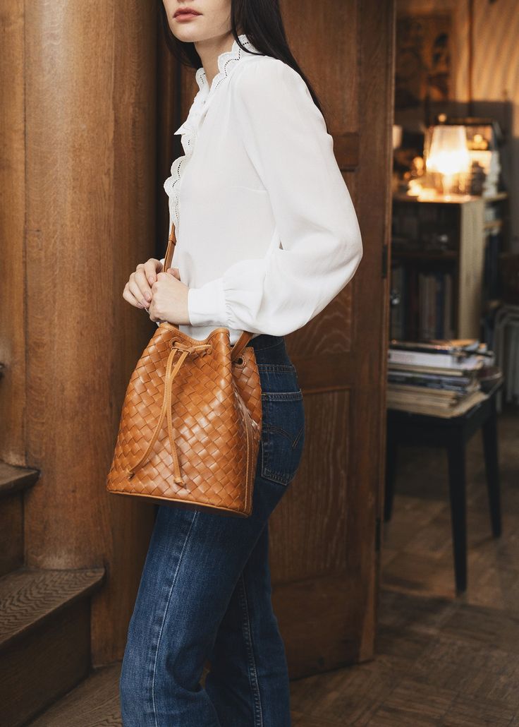 A classic bucket bag reimagined in our signature carré leather. With a long adjustable shoulder strap to wear it over the shoulder or crossbody. The paneled leather bottom maintains a slouchy effect without the sag. A versatile and timeless style to wear year-round. Give Back, Small Accessories, Handbag Shopping, Adele, Handbags On Sale, Timeless Style, Sales Gifts, Tote Handbags, Bucket Bag