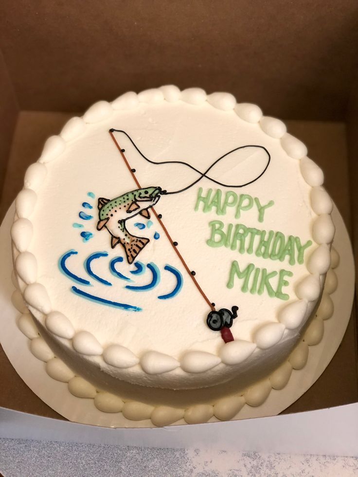 a birthday cake with an image of a fishing fisherman on the side and happy birthday mike written on it