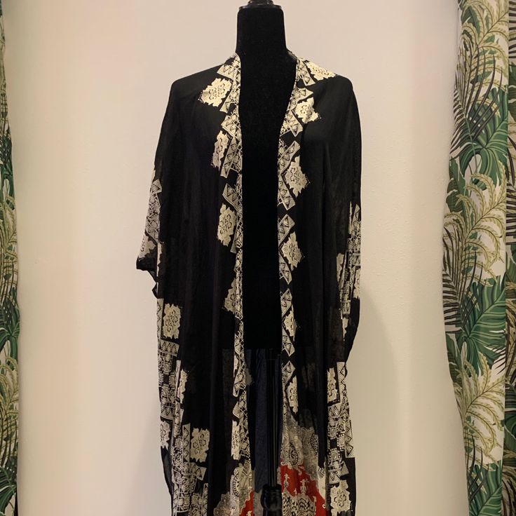 Long Traditional Kimono Wears With Everything. Casual Black Outerwear For Vacation, Chic Black Outerwear For Vacation, Bohemian Black Outerwear For Vacation, Black Bohemian Outerwear For Vacation, Black Outerwear For Vacation In Fall, Black Open Front Kimono For Fall, Black Long Outerwear For Festivals, Casual One Size Black Kimono, Long Black Outerwear For Festival