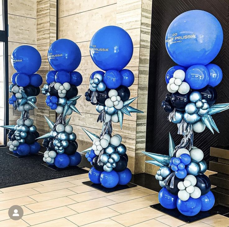 blue and silver balloons are on display in the lobby