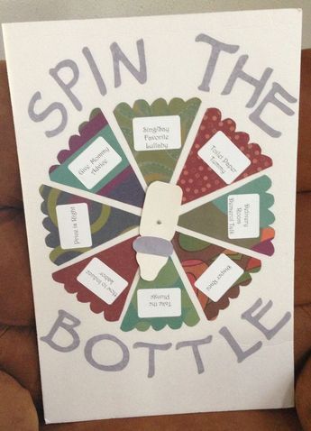 a sign that says spin the bottle on it and has labels in front of it