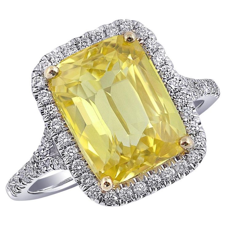 If you are looking to buy a simple yet elegant ring, then this 7.02 carats Yellow Sapphire Ring is for you. This captivating two tone gold diamond and Yellow sapphire ring provides incomparable beauty with unmatched quality. A halo of diamonds surrounds the center stone, providing the added sparkle to this exquisite ring. This is the most unique and eye-catching rings that you have ever seen. So, don't wait, buy this elegant ring today. Ring Overview SKU 3771 Center Stone Yellow Sapphire Side Stones Diamonds Metal Type 14K White and Yellow Gold Metal Weight 3.64 gr Report GIA Report Size 6.5 Center Stone Quantity 1 Total Weight 7.02 carats Color Yellow Color intensity Strong Shape Cushion Clarity Very eye clean Cut Brilliant/step Treatments Unheated Dimensions 11.59 x 8.72 x 6.58 mm Diamon Sapphire Side Stones, Yellow Sapphire Ring, Yellow Sapphire Rings, Purple Grapes, 14k Rose Gold Ring, Garnet Earrings, Yellow Gold Earring, Elegant Ring, Yellow Sapphire