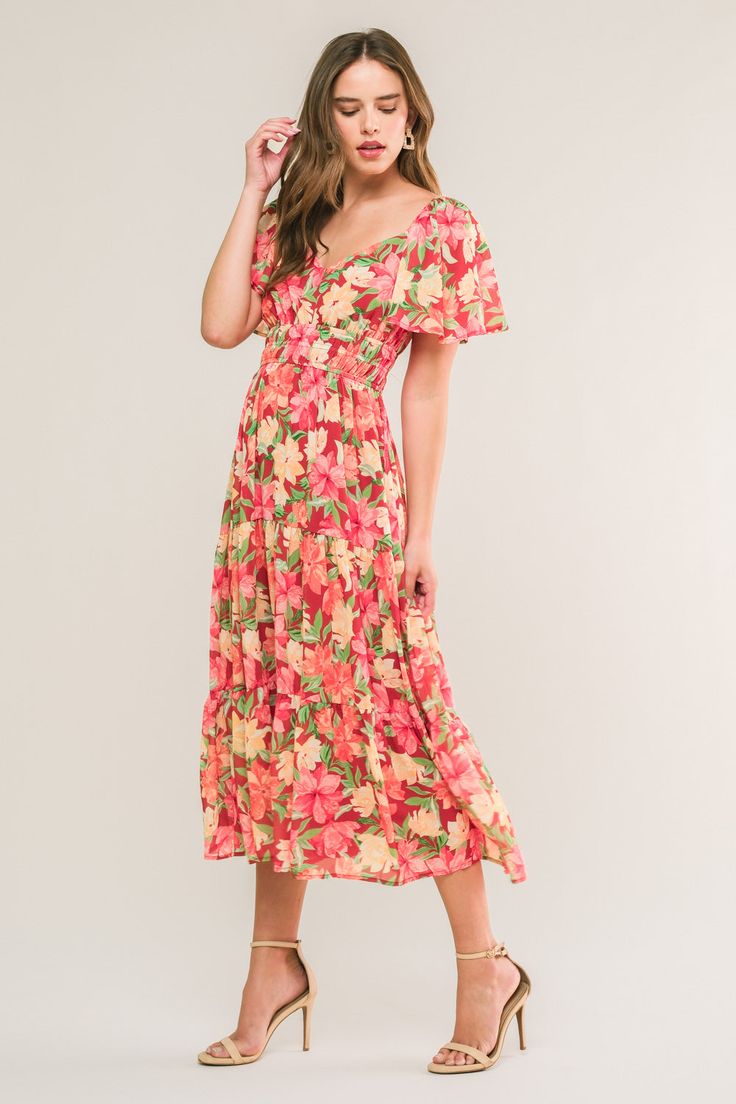 A printed woven midi dress featuring sweetheart neckline, short flutter sleeve, elasticized waist line and tiered skirt Details: Self : 100% PolyesterLining : 100% Polyester Size & Fit - Model is 5`8" And Wearing Size Small- Measurements Taken From Size Small- Approx. Length: 44" Casual Midi Dress With Ruffle Sleeves For Vacation, Casual Midi Dress With Ruffle Sleeves For Beach, Feminine Multicolor Midi Dress With Short Sleeves, Feminine Tiered Dress With Elastic Waistband, Summer Midi Dress With Elastic Waistband, Casual Flutter Sleeve Midi Dress For Brunch, Casual Midi Dress With Flutter Sleeves For Brunch, Feminine Multicolor Short Sleeve Midi Dress, Pink Dress With Elastic Waistband For Brunch