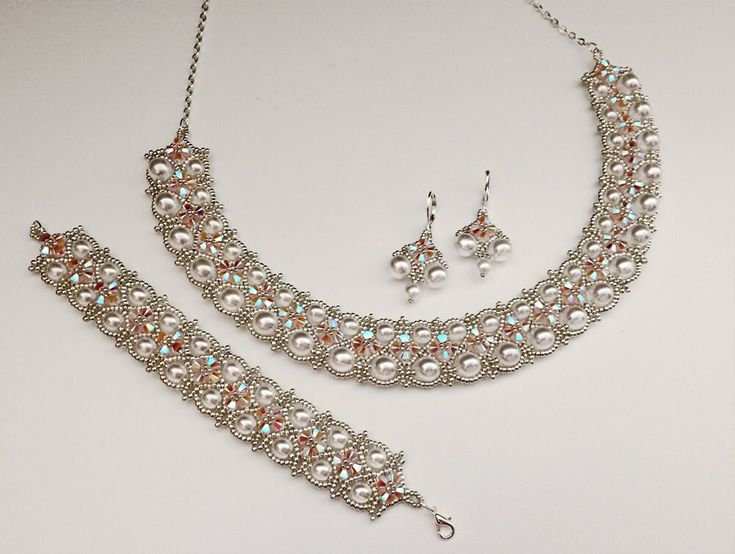 a necklace and earring set with pearls