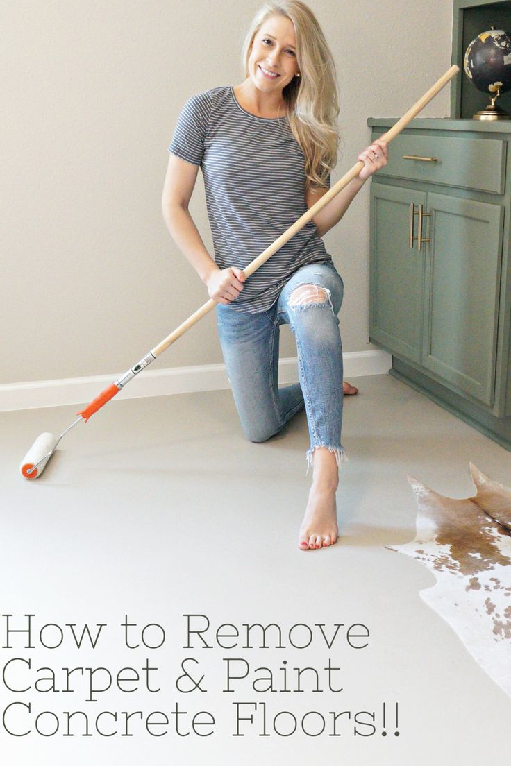 a woman sitting on the floor with a broom in her hand and text how to remove carpet & paint concrete floors