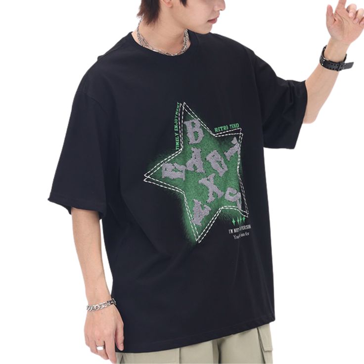 Introducing the Star Letter Graphic Cotton T-shirt, a perfect blend of comfort, style, and individuality. Crafted with the finest quality materials and attention to detail, this t-shirt is designed to make a bold statement wherever you go. Features: -100% Cotton -Crew neckline -Star graphic front -Regular fit -Unisex style Casual Black T-shirt With Star Print, Trendy Star Print T-shirt For Streetwear, Trendy Star Print Streetwear T-shirt, Casual Star Print T-shirt For Streetwear, Black Star Print Casual T-shirt, Black Casual T-shirt With Star Print, Black Cotton Tops With Star Print, Trendy Relaxed Fit T-shirt With Star Print, Black Short Sleeve Tops With Star Print