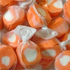 orange and white candies are in a bag