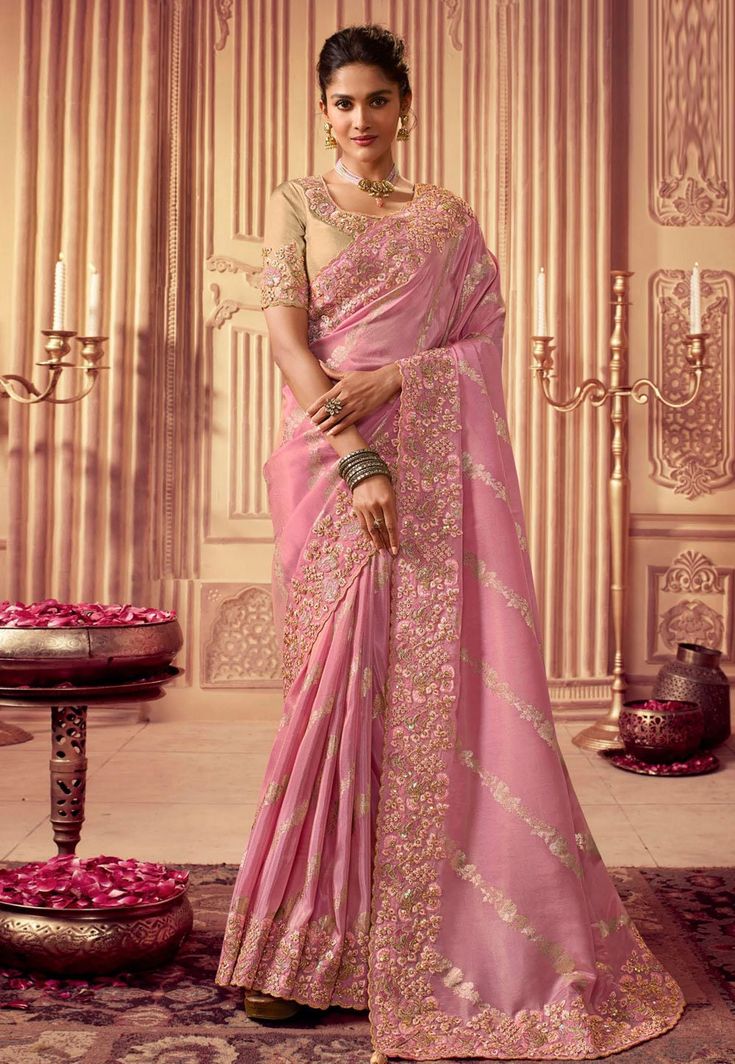 **Beautiful Pink Hand-Embroidered Viscose Silk Saree with Designer Blouse** --- **Product Description Feel like a princess in this stunning pink saree! This beautiful saree is perfect for weddings, parties, and festivals. It has amazing hand-embroidered flowers, and it's made from soft and shiny viscose silk. The matching blouse is super pretty with its detailed embroidery. **Key Features - **Material High-quality viscose silk, soft and shiny. - **Color Lovely shade of pink, elegant and charming Draped Sarees, Baby Pink Saree, Saree Green, Elegant Sarees, Bridal Sari, Organza Silk Saree, Beautiful Sarees, Sari Dress, Party Mode