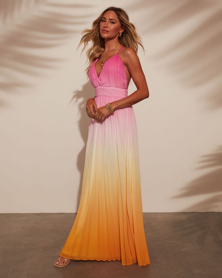 Where sunset hues meets effortless style, the Cora Ombre Maxi Dress was designed. Crafted from a pleated lightweight fabric, it flows gracefully with every step. The crisscross back straps add a touch of allure, perfect for warm evenings and beachside escapes. Embrace relaxed sophistication with this timeless piece that effortlessly transitions from day to night. V neckline Pleated lightweight fabric Adjustable crisscross back straps Hidden back zipper closure Lined 100% polyester Runs Large Chic Maxi Dress With Crisscross Straps For Summer, Chic Summer Maxi Dress With Crisscross Straps, Flowy Summer Maxi Dress With Crisscross Straps, Summer Evening Ombre Maxi Dress, Pink Beach Dress With Crisscross Straps, Sleeveless Ombre Dresses For Spring, Summer Maxi Dress With Strappy Crisscross Straps, Elegant Ombre Maxi Dress For Summer, Summer Evening Dresses With Cross Back