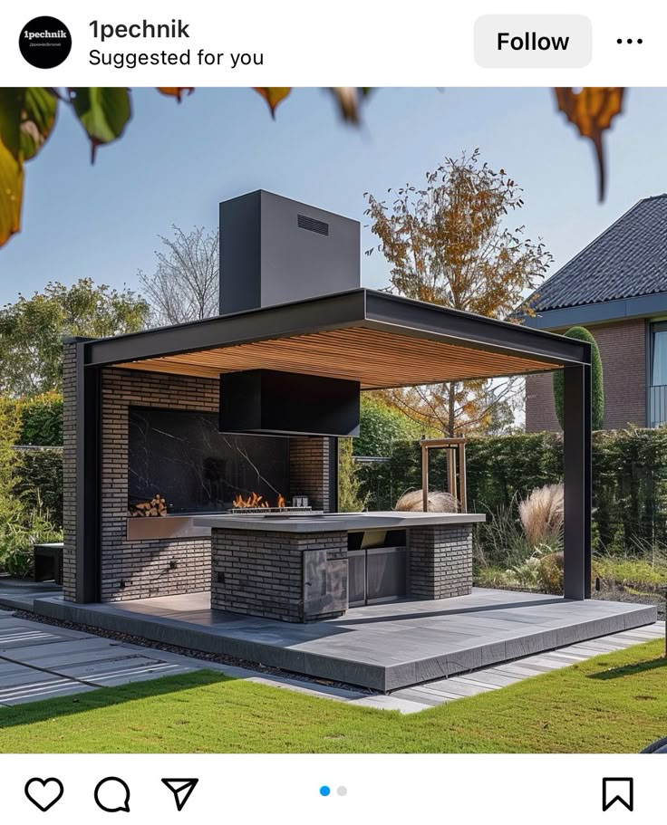 an outdoor bbq in the middle of a yard