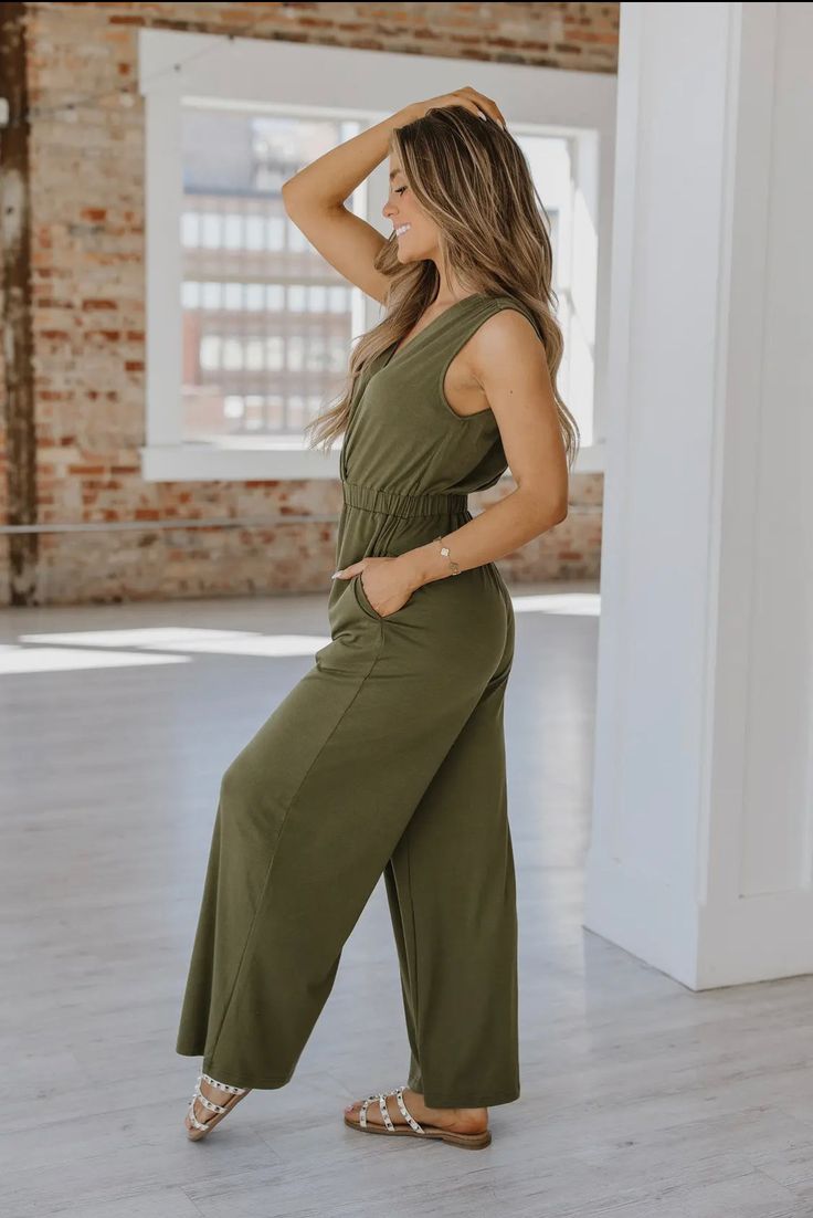 A sleek wide leg design, this jumpsuit offers a flattering and comfortable fit! 65% Viscose, 30% polyester, and 5% Elastane Versatile Jumpsuits And Rompers For Loungewear With Elastic Waistband, Chic Maxi Length Jumpsuits And Rompers With Elastic Waistband, Wide-leg Jumpsuits And Rompers With Elastic Waistband For Loungewear, Chic Wide-leg Jumpsuits And Rompers For Loungewear, Chic Full Length Jumpsuits And Rompers For Loungewear, Versatile Jumpsuits And Rompers With Elastic Waistband, Versatile Wide Leg Jumpsuit Or Romper, Chic Full-length Jumpsuits And Rompers With Pockets, Wide Leg Solid Color Jumpsuits And Rompers For Loungewear